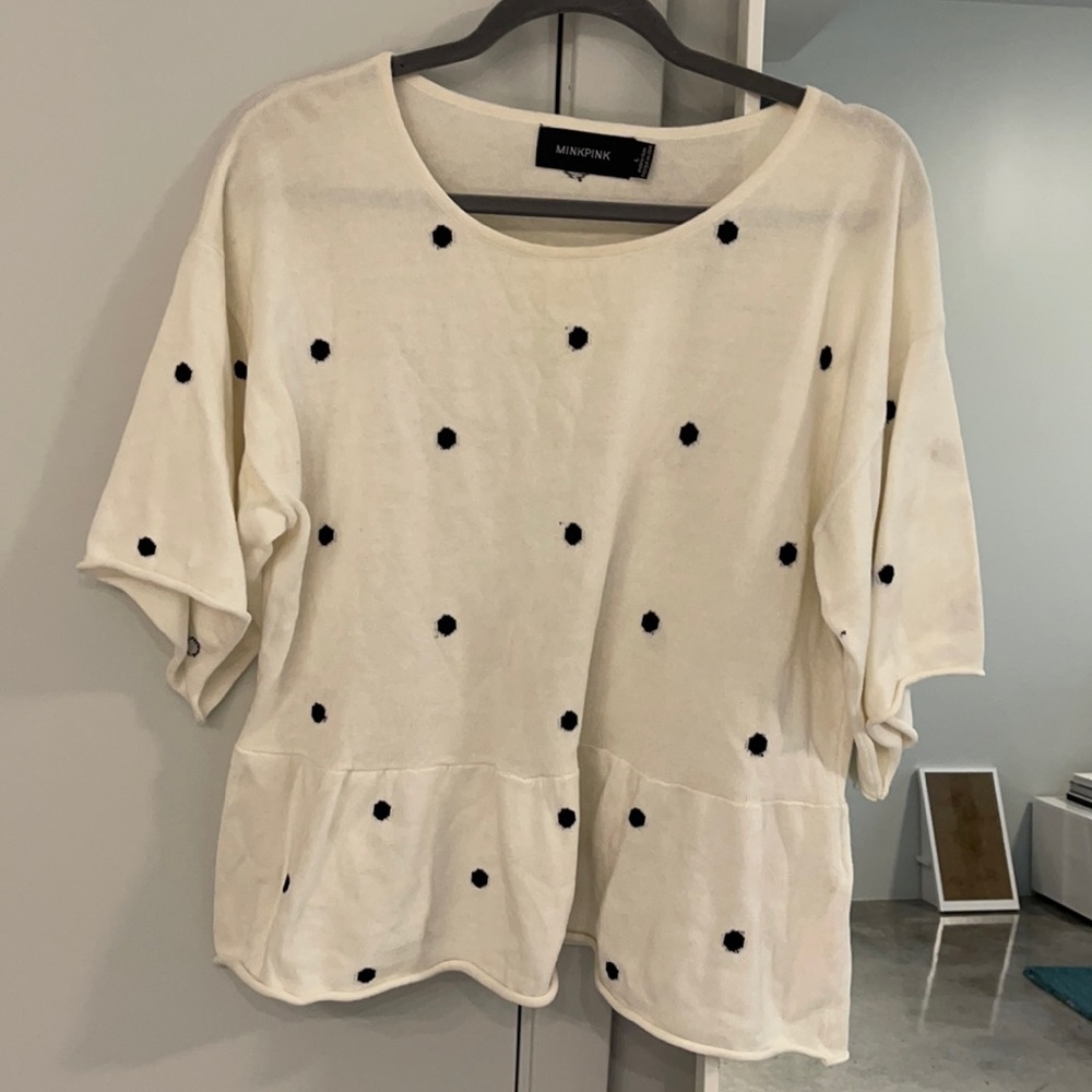 Black and white peplum knit top size large